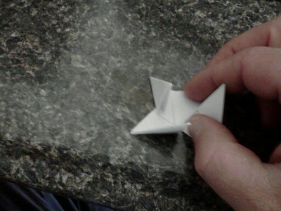 Fold the Ends Over Like Closing a Cardboard Box.  the Last One You Will Have to Go Over and Tuck Under