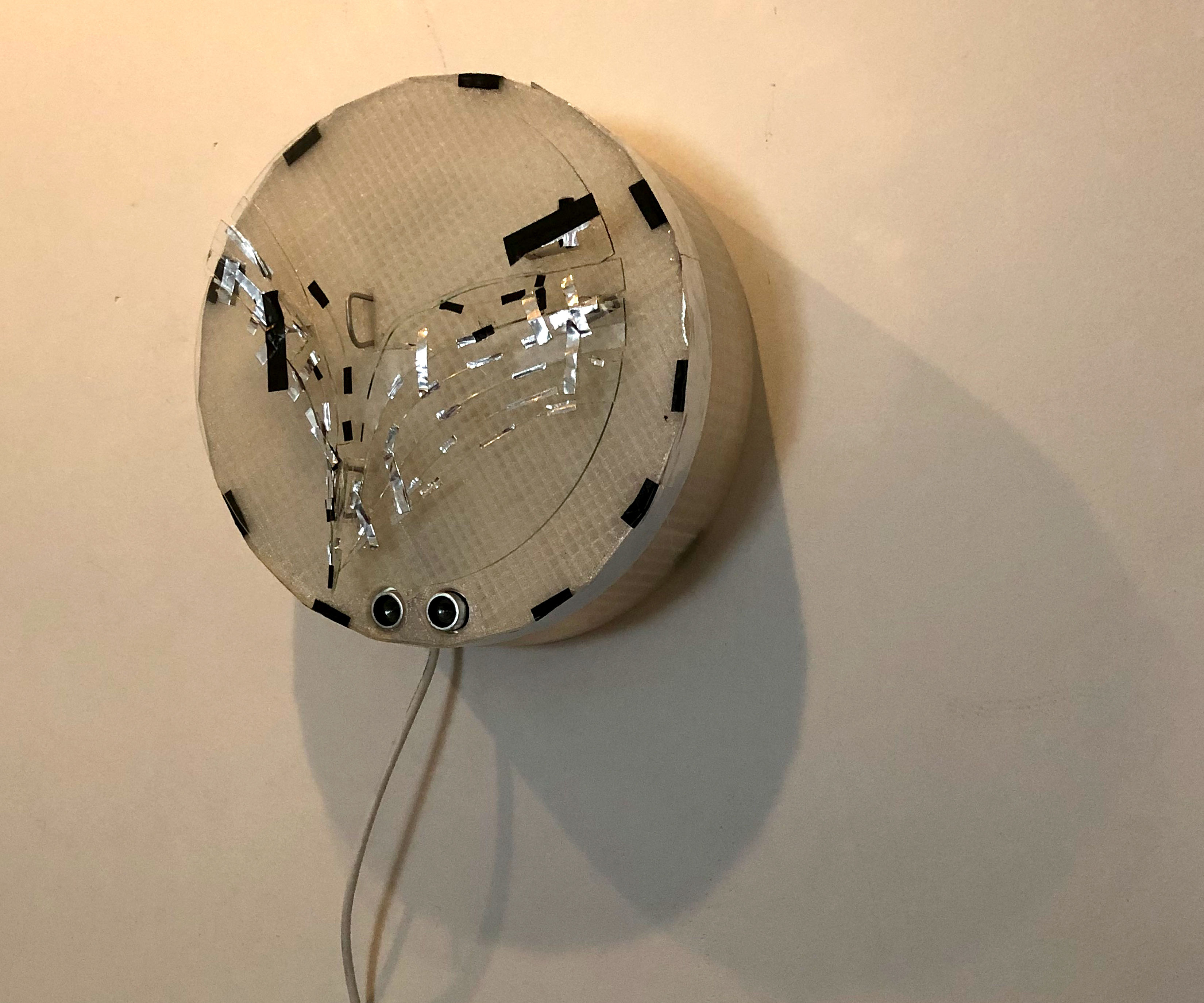 BRKN GLSS // Arduino Reads Proximity Sensor Causing 2 Servo Motors to Activate 