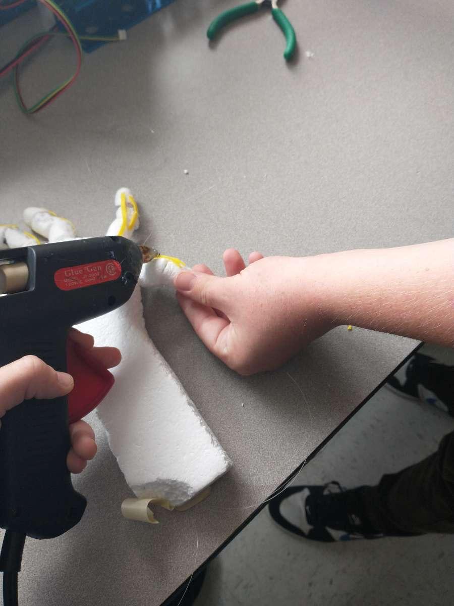 Glue the Rubber Bands to the Fingers