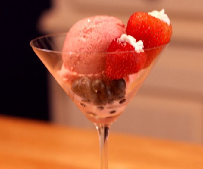Strawberry Ice Cream With a Blueberry Syrup