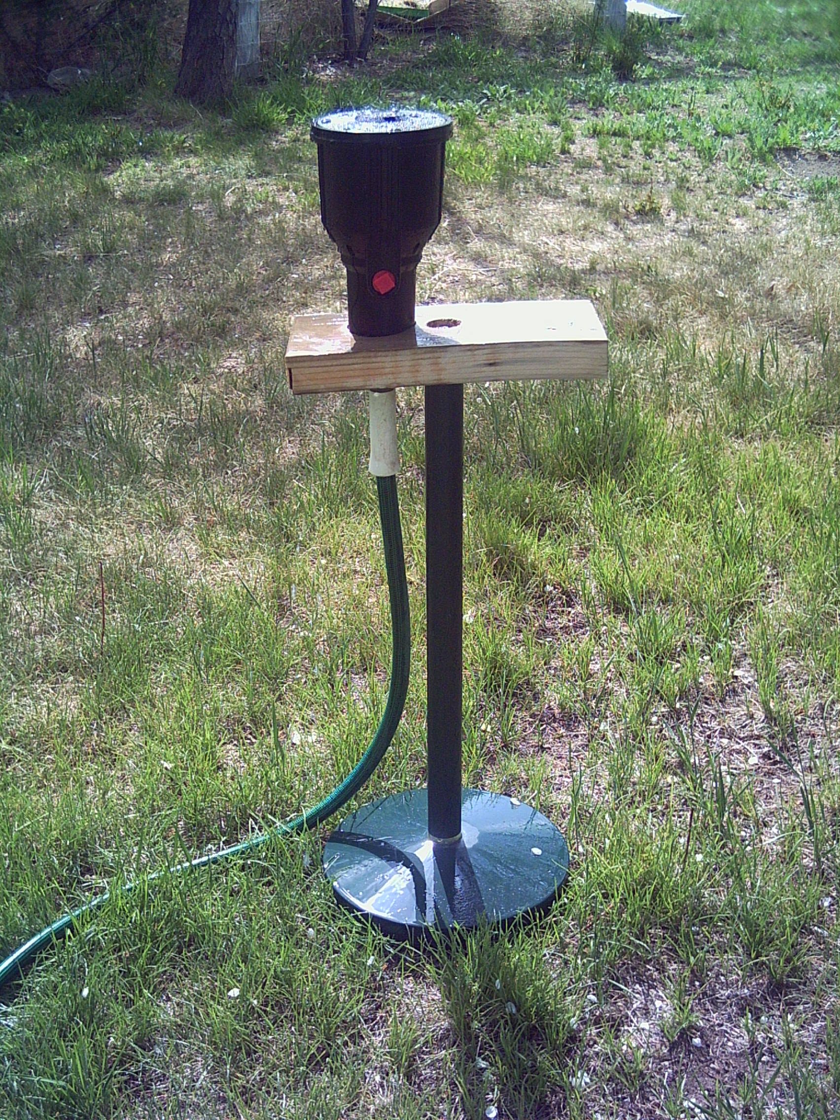 Sprinkler Stand Out of a Torchiere Style Lamp