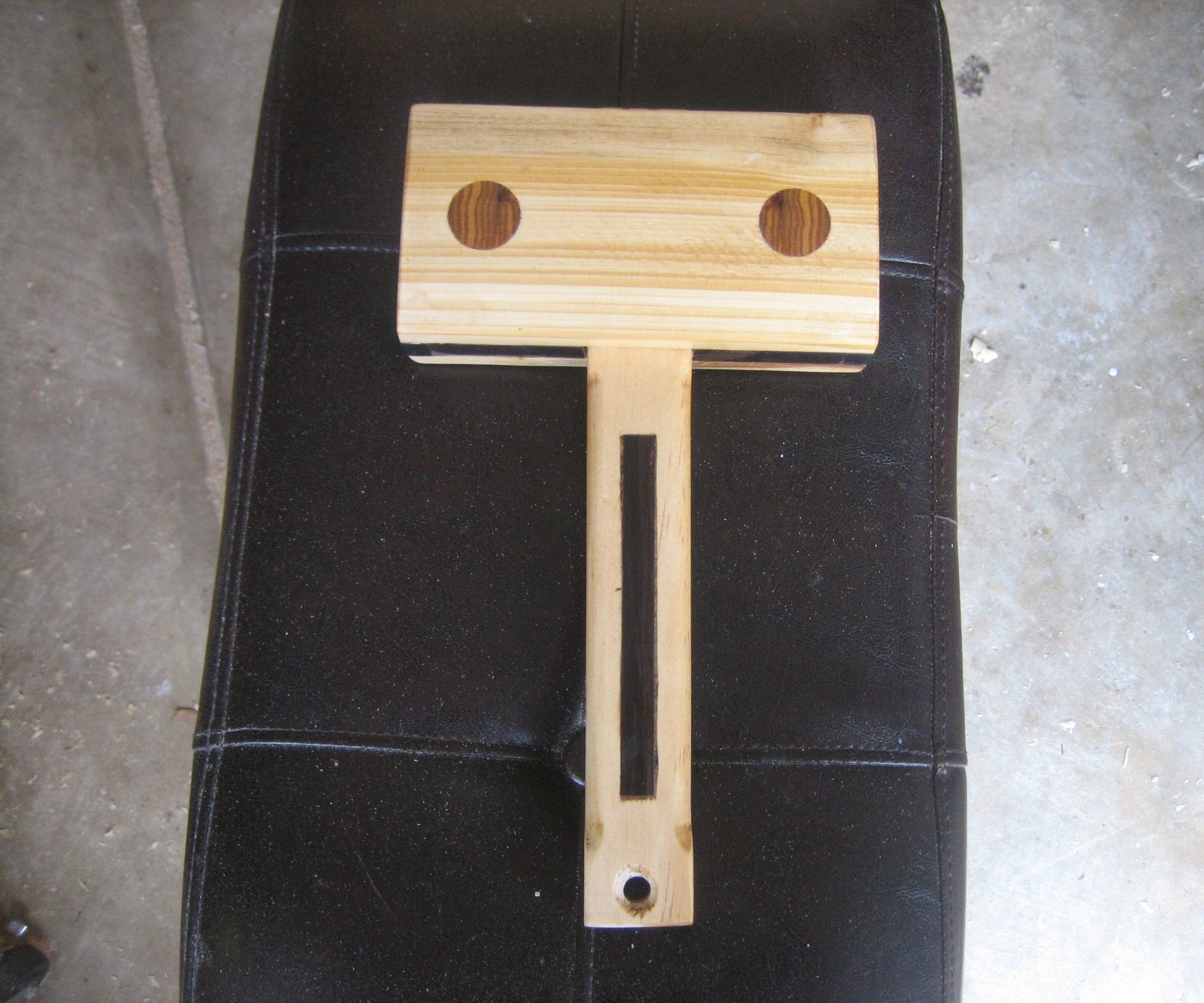 A WOODEN MALLET