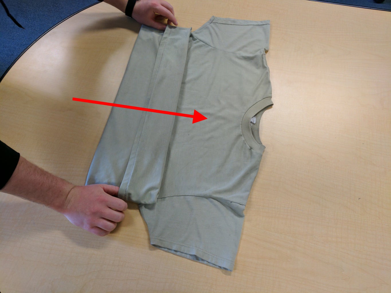 Fold Shirt Horizontally in Half to Check Back of Cuff, Then Undo Fold