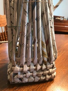Begin Weaving the Newspaper.