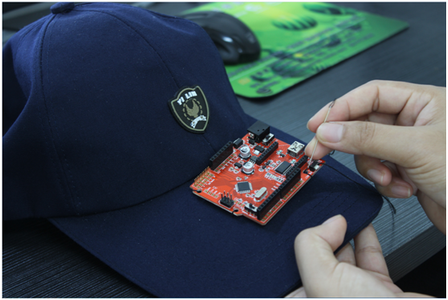 Sew the Crowduino Onto the Cap