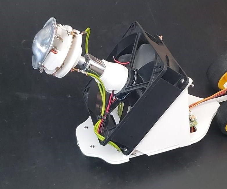 The Cotton Candy Enigma: Exploring Material Deposition Through Miniature Mobile Robots and Augmented Reality