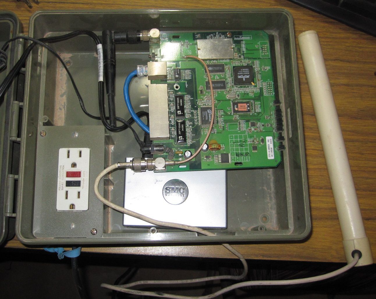 Outdoor Wrt54G Router with powerline Network adapter to supply internet to Wifi IP cameras