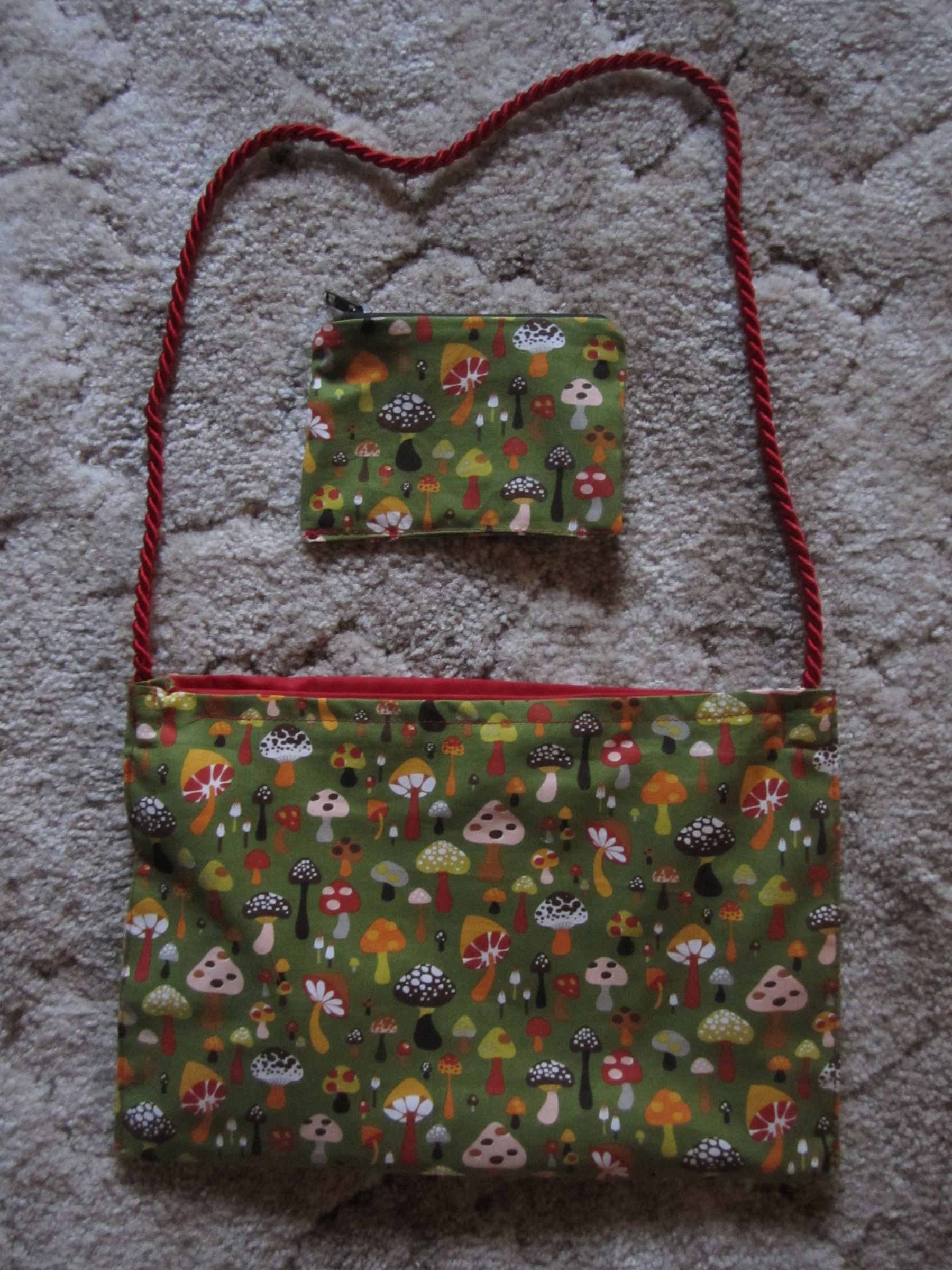 Lined bag with handle and matching zipper coin purse
