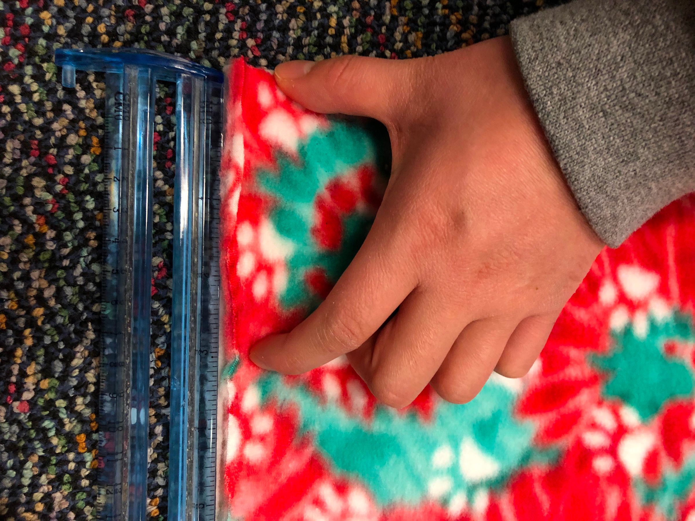 How to Make a Simple NoSew Fleece Blanket With a Braided Edge 8