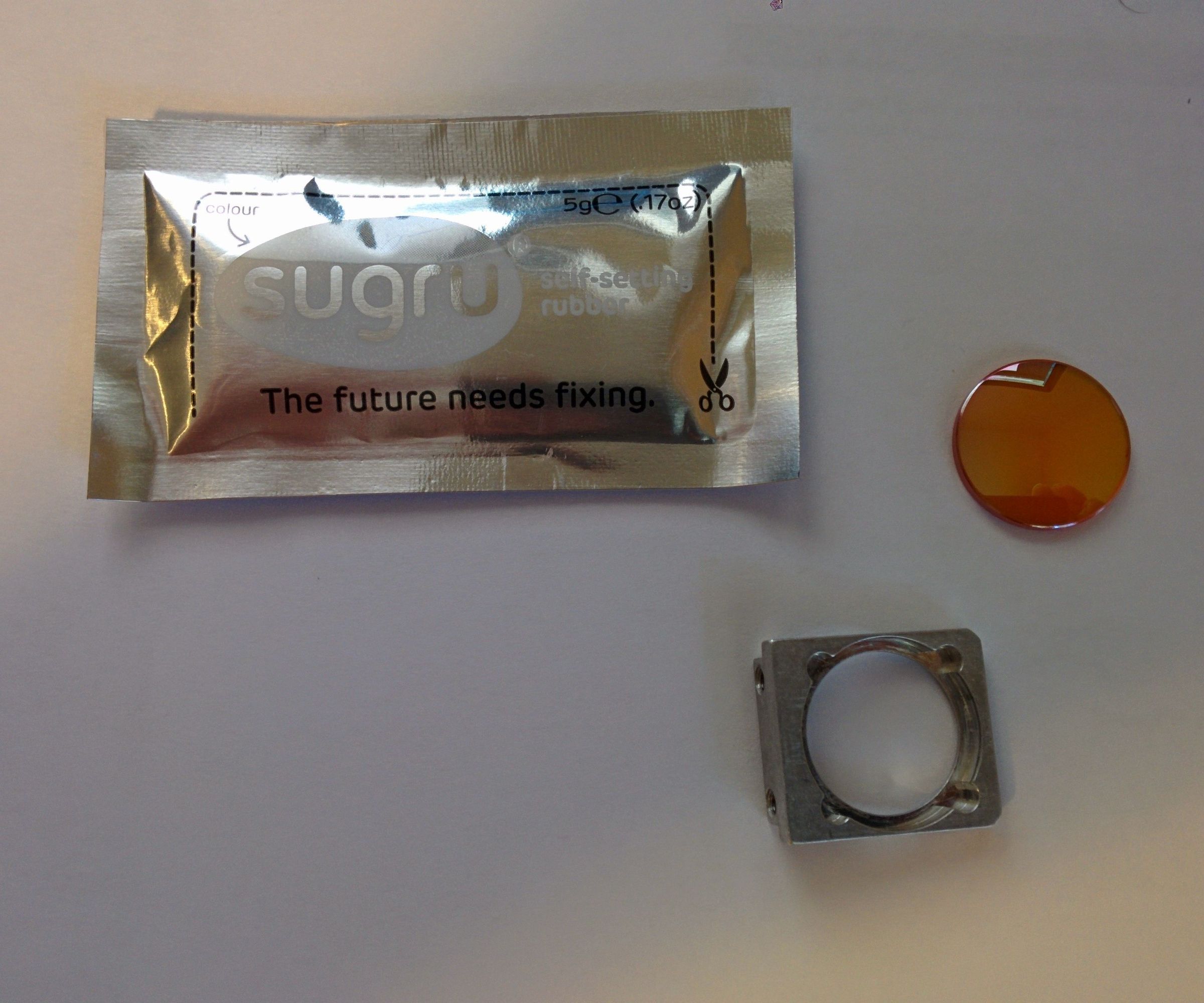 Repair a Universal Laser Cutter Lens Holder With Sugru!