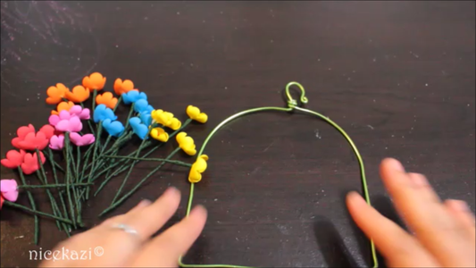 Wrapping the Swing With Flowers and Beads: