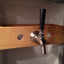 Make a beer tap mount to hang inside the refrigerator door.