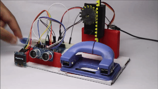 Automatic Paper Hole Punch Device Using Arduino