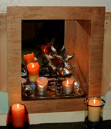 Turning an Unused Fireplace Into a Candle Nook.
