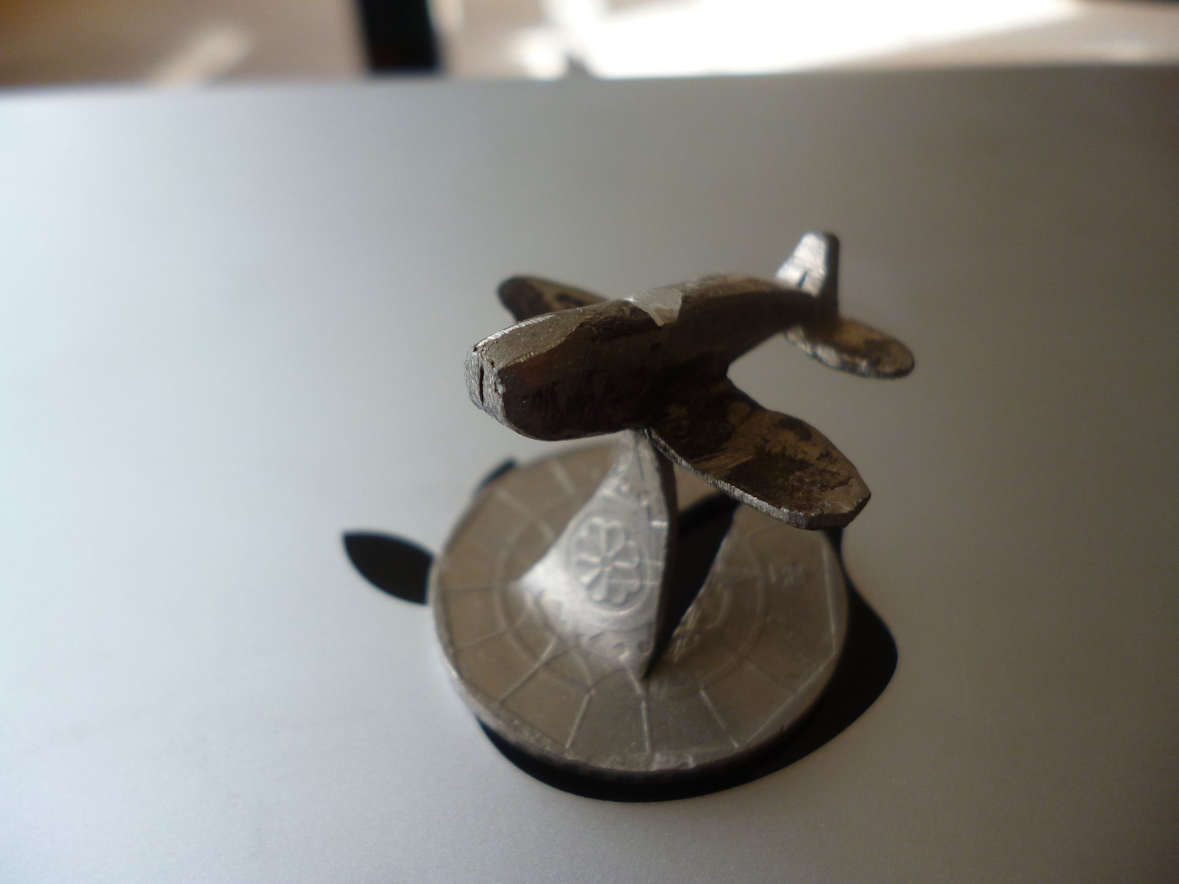 How to Make a Miniature Plane From a Coin