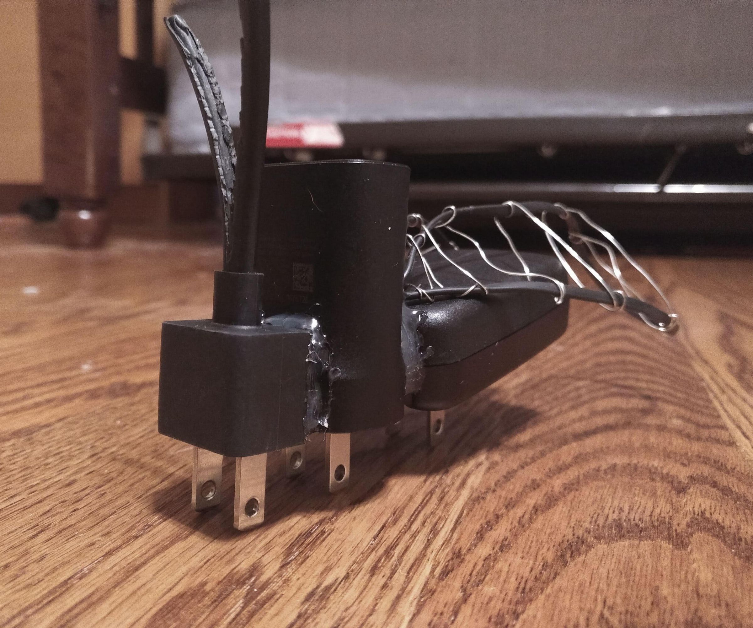 Fly Sculpture From Broken Chargers