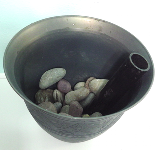 Use a Piece of Pipe, to Go From the Bottom of the Pot to the Top.