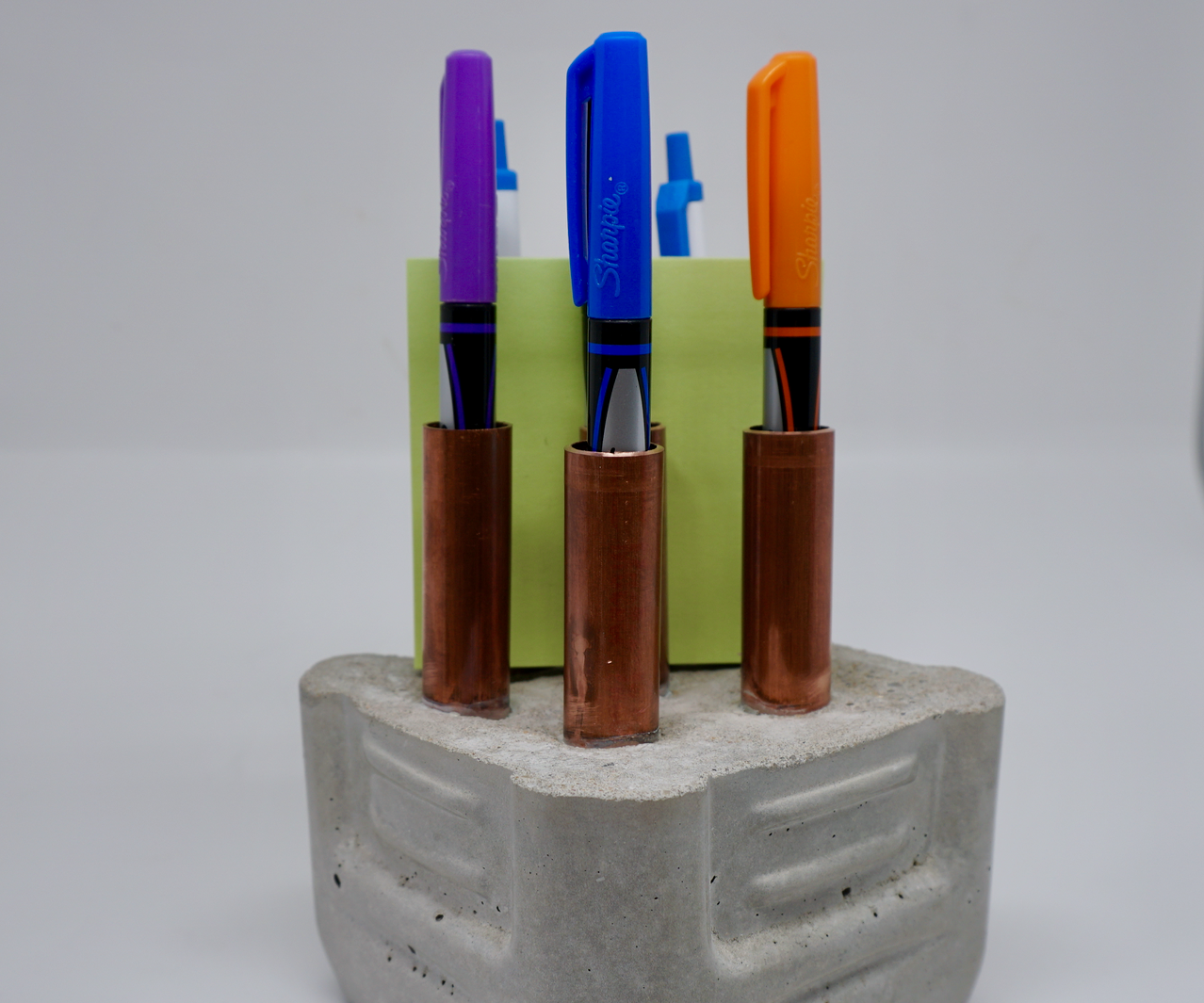 Concrete and Copper Pipe Holder