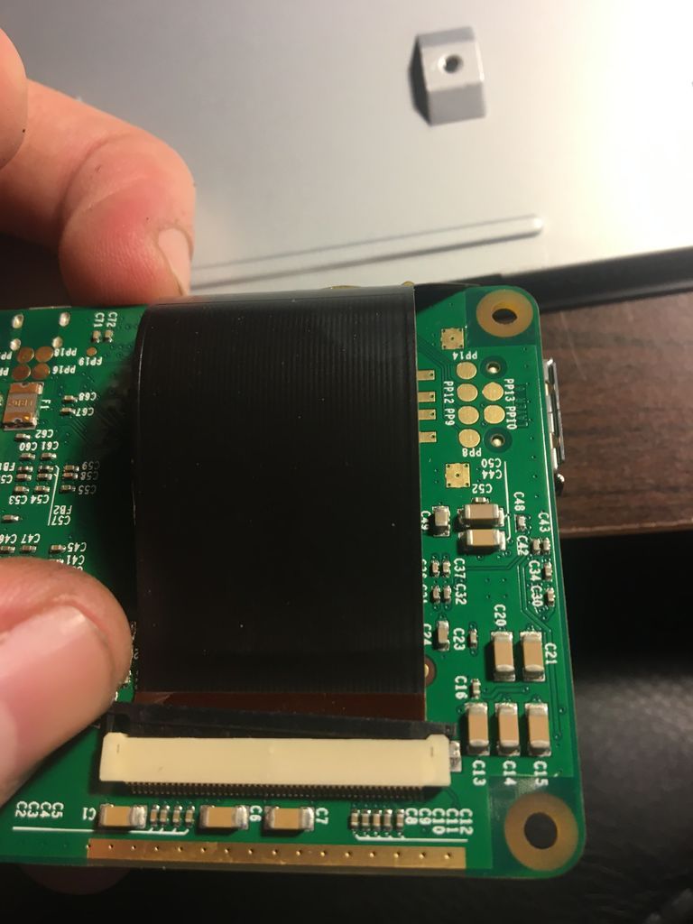 Insert MicroSD Card Into Raspberry Pi and Attach 3D Printed Frame
