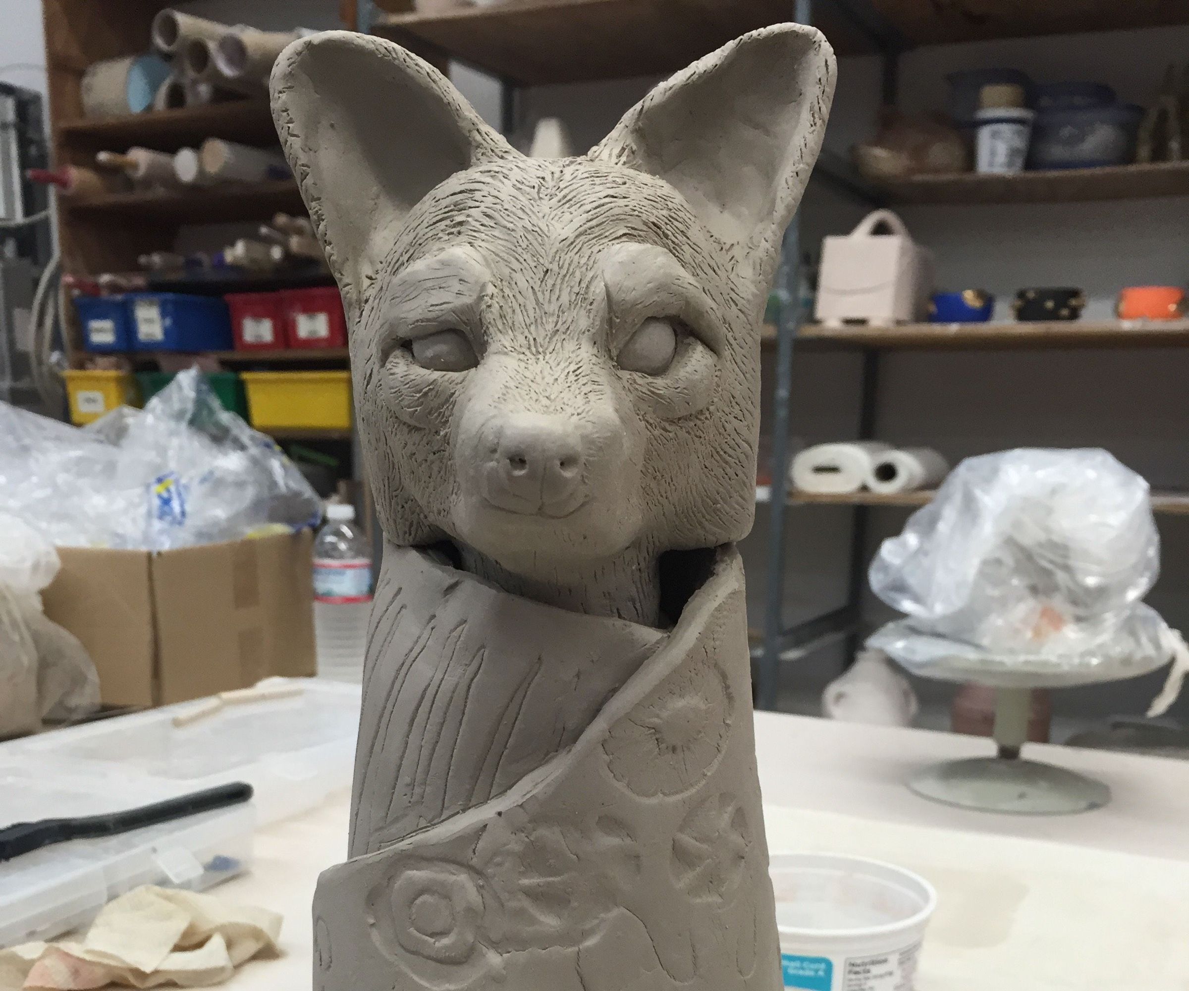 How to wrap a blanket to an animal head in clay