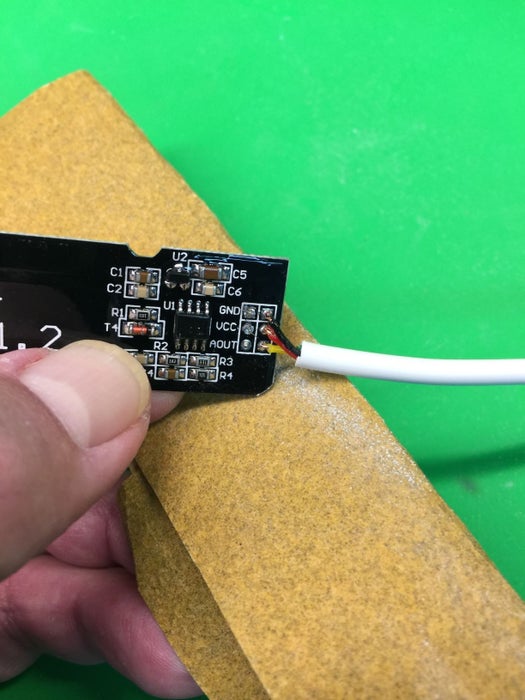 File the Corners of the PCB Sensor With Sandpaper or a File