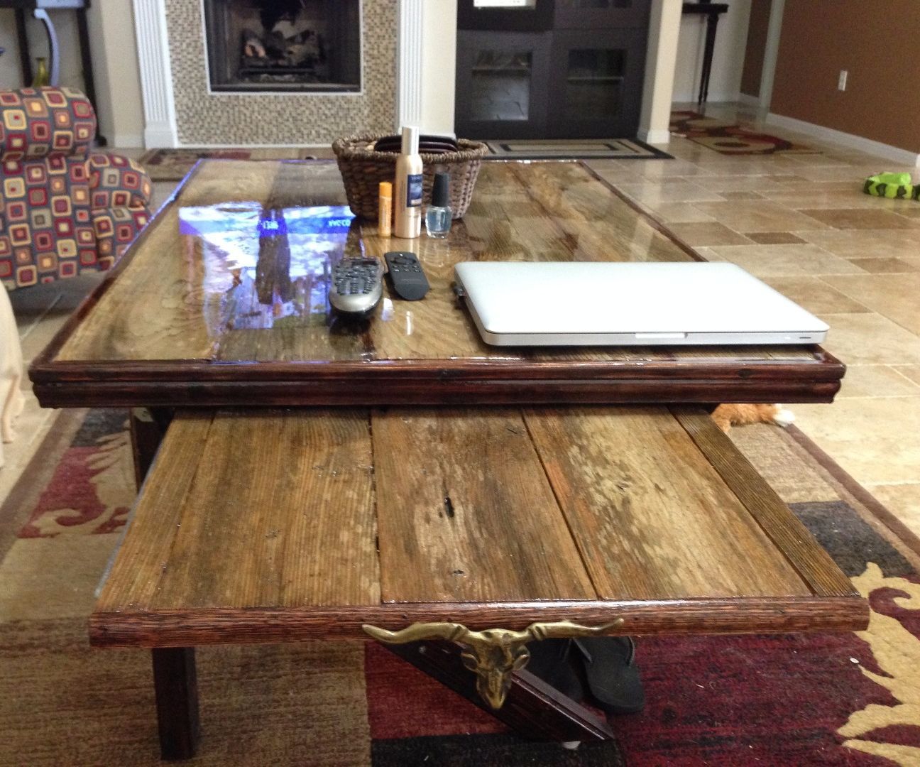Resin top reclaimed wood coffee table with slide out TV tray and funky leg design