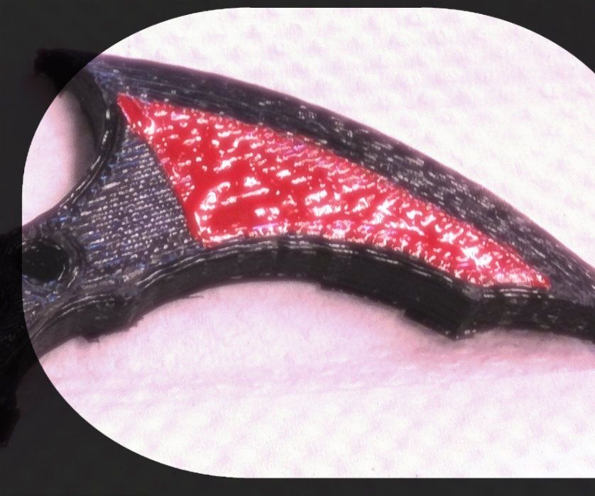 Painting the 3D Printed Batarang With Red Enamel Paint