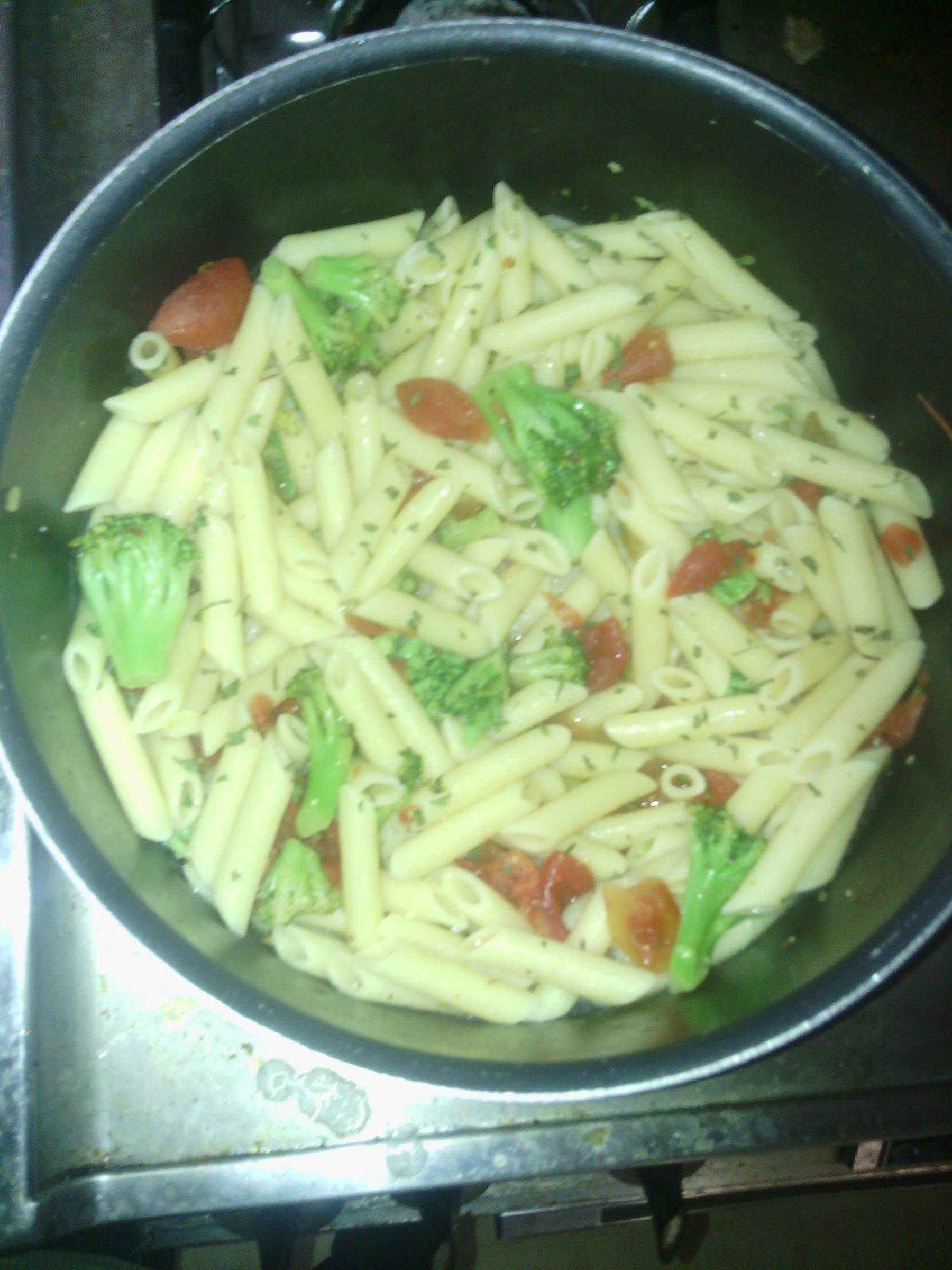 Penne Pasta W/ Broccoli and Tomato Garlic Butter Sauce