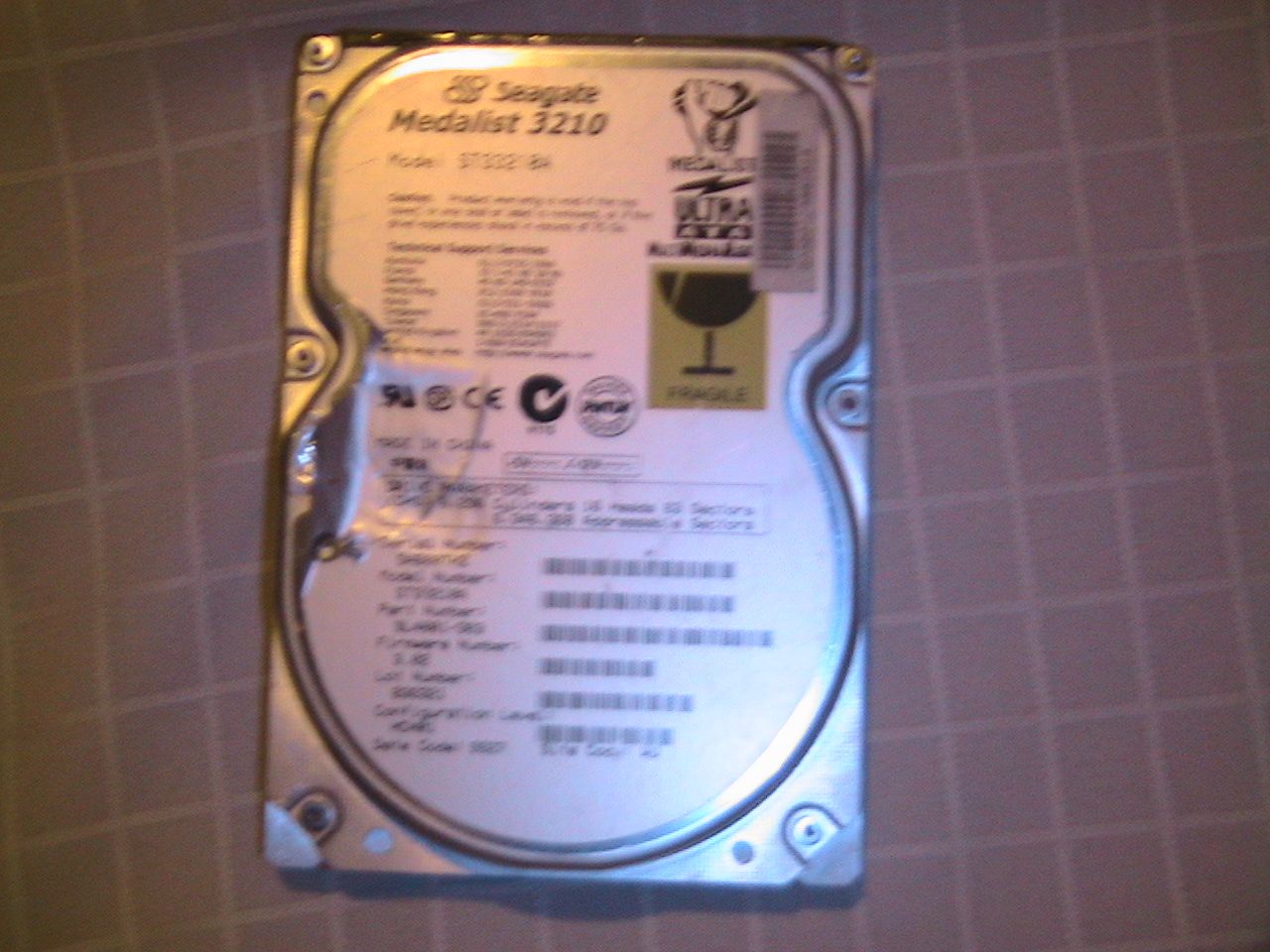 Pulling apart a desktop hard drive to get rare earth magnets.
