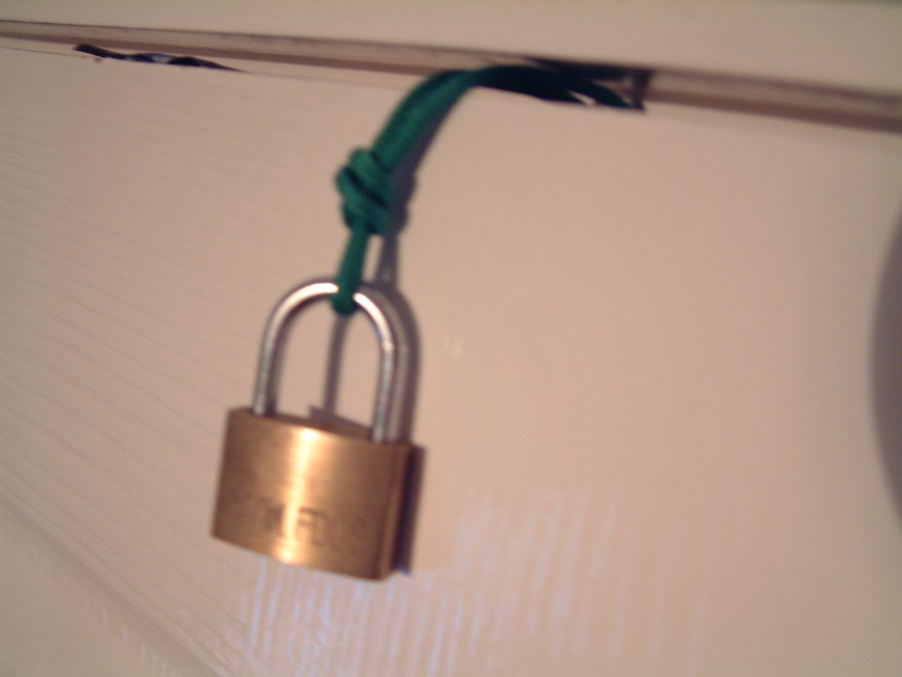 Lock a door using paracord