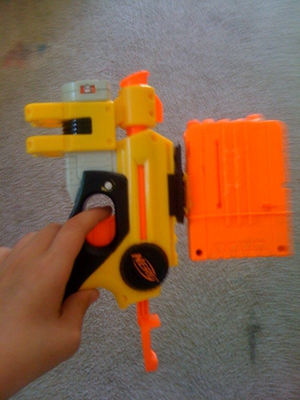 dart storage/ejection attachment