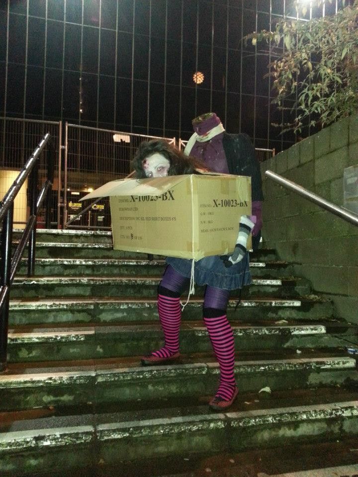 Headless Zomby Woman Carrying Her Own Head on a Box