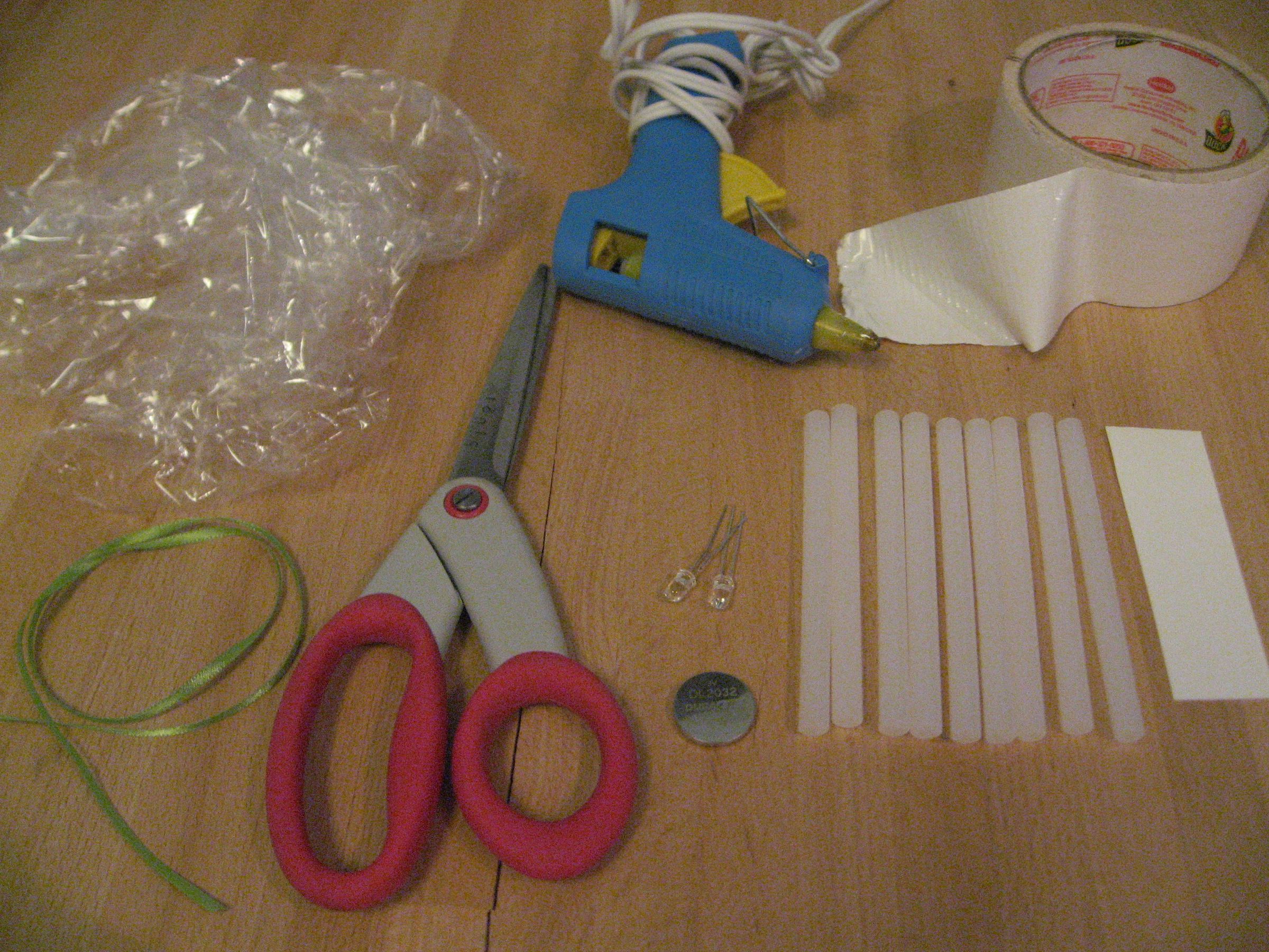 Light Up Bow From Saran Wrap and Hot Glue and LED Throwie 6 Steps