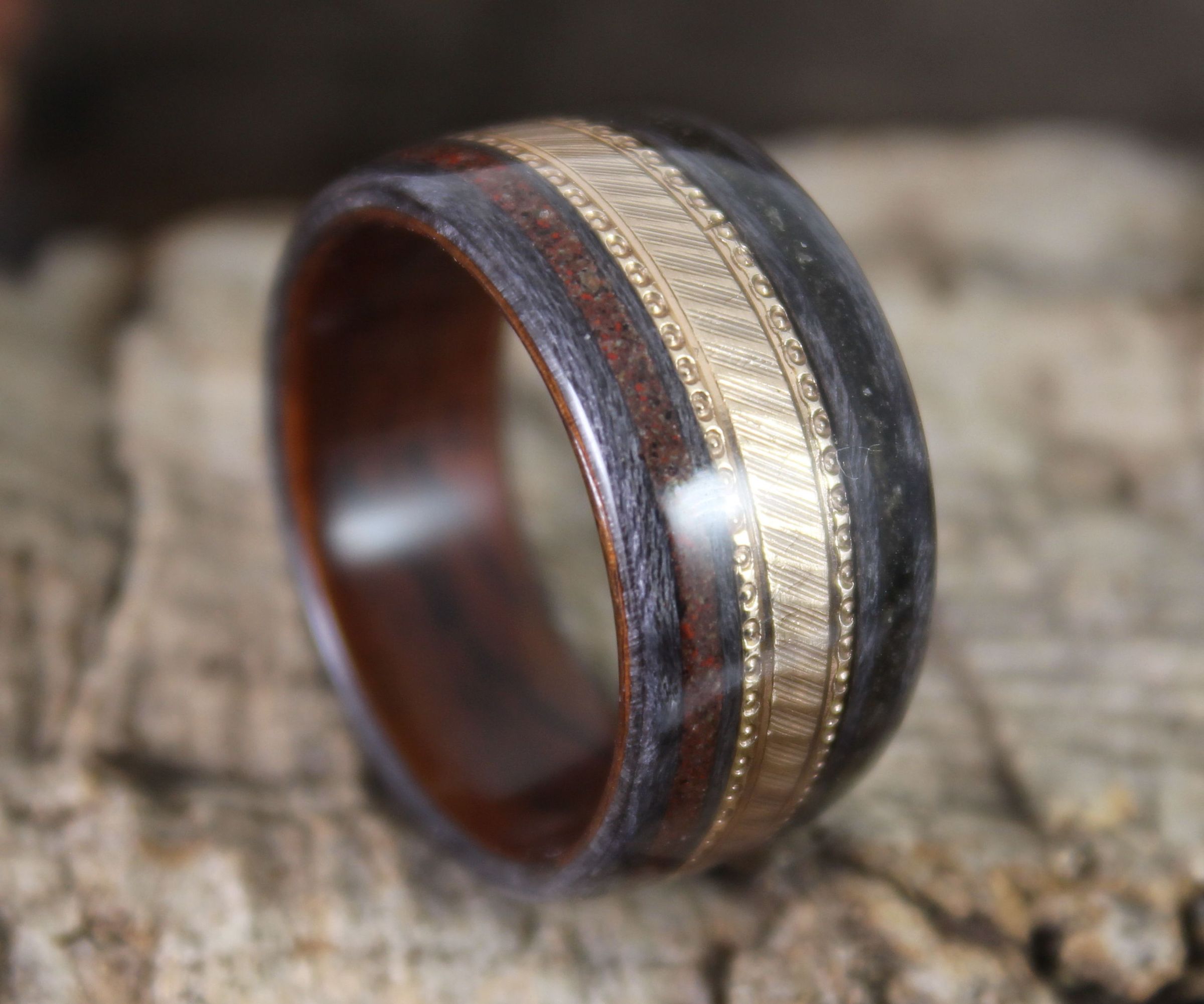 Gold Wedding Ring in a Wooden Ring