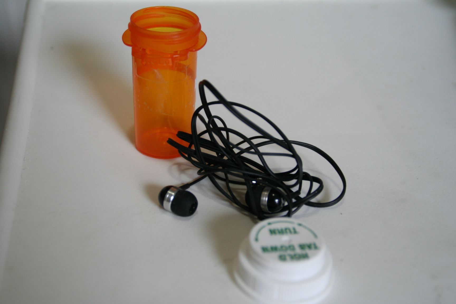 Store Earbud Headphones in Medicine Vials