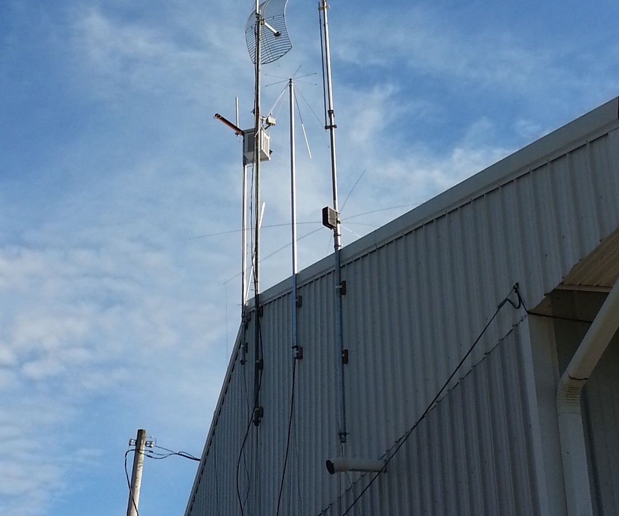 Low Budget Method to Mount Antenna Masts to a Building