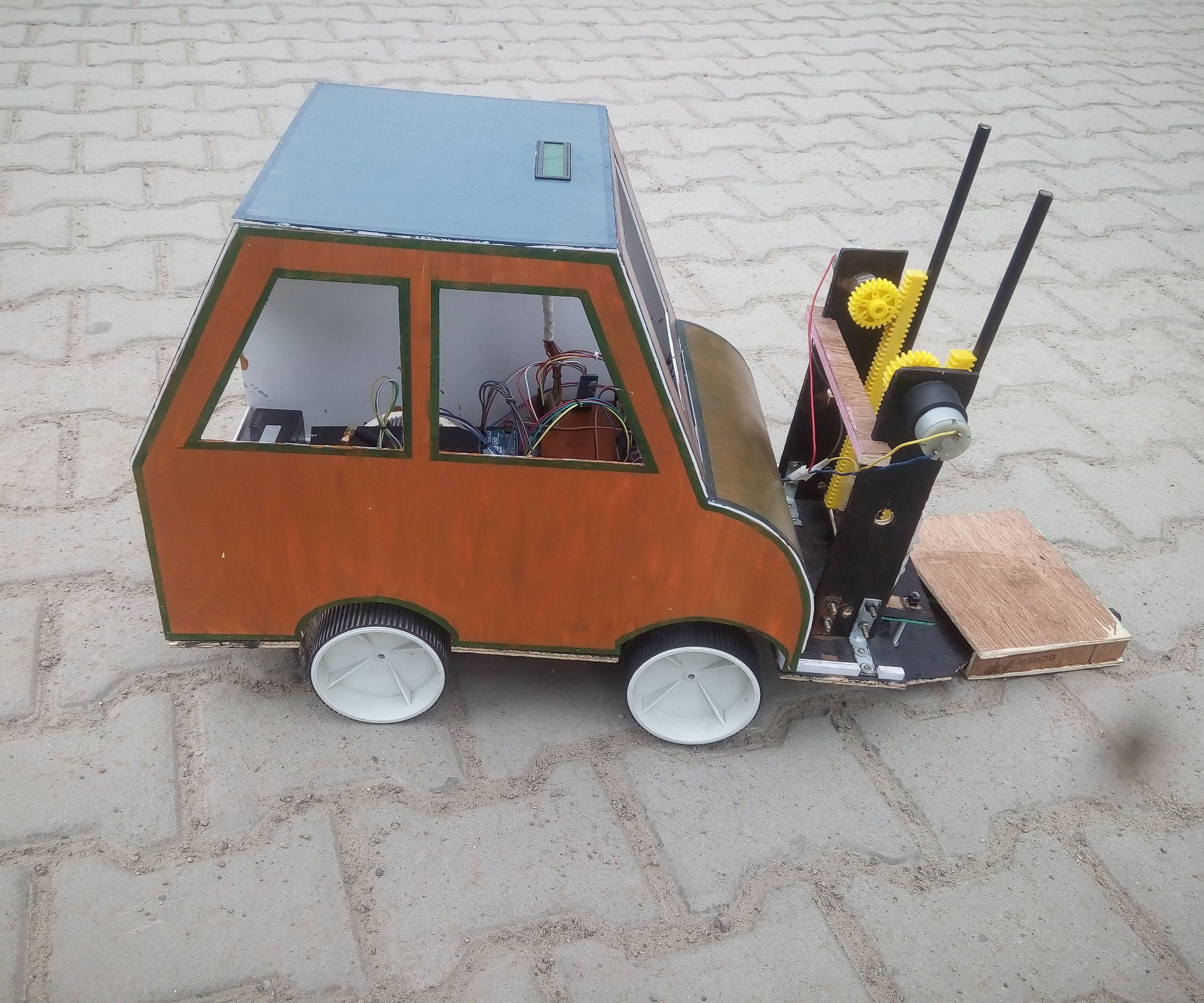 GSM and Bluetooth Based Material Handling Robot