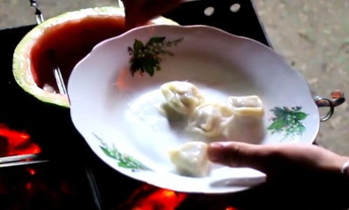 Cut Off the Top of a Watermelon, Remove Flesh, and Put Frozen Ravioli Inside the Watermelon.