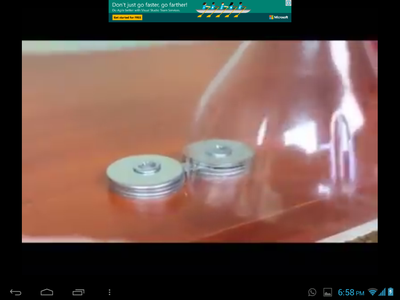 PUT THE PLASTIC BOTTLE ON THE SHARPENER BLADE AND KEEP ROTATING IT SO THAT THE PLASTIC CAN BE CUT INTO ROPE.
