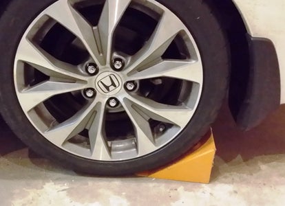 Loosen the Axle Nut and Jack Up the Car