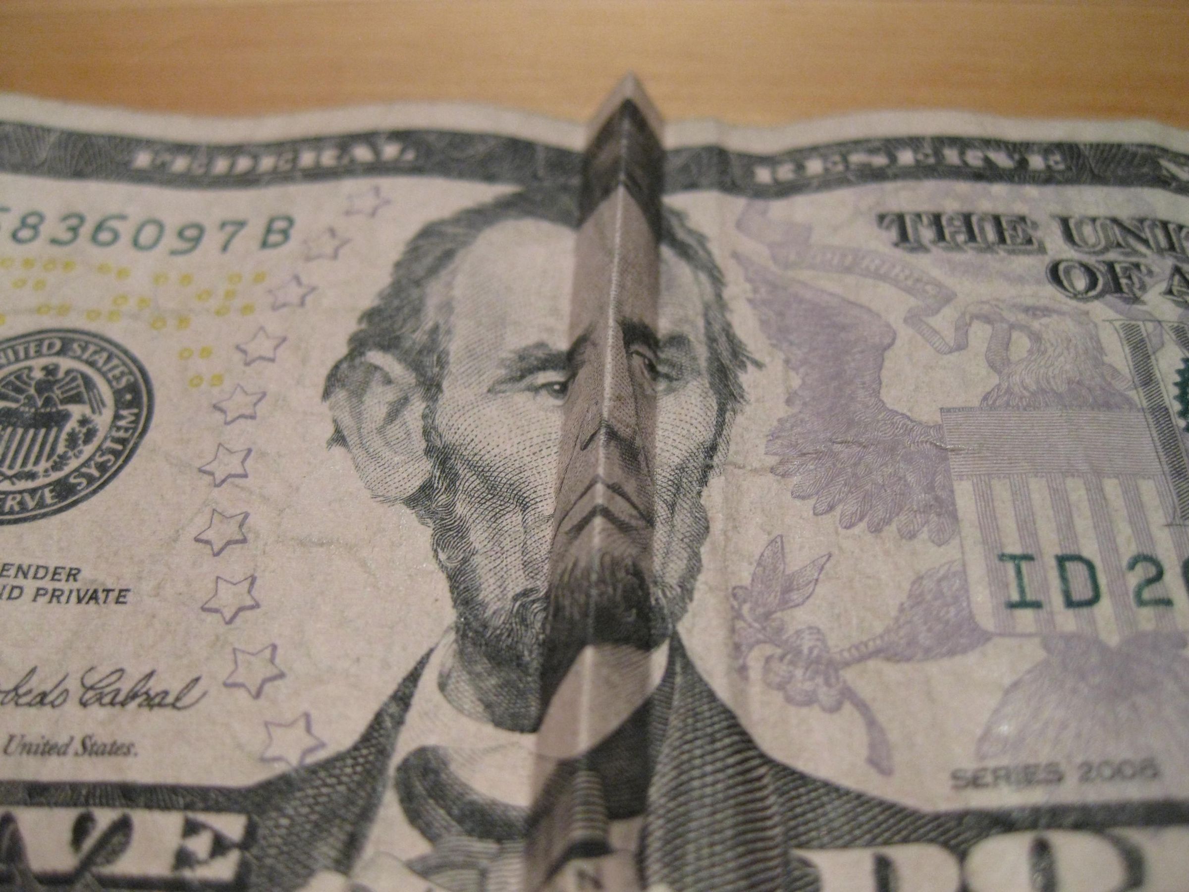 Money Tricks:  How to make Abe Lincoln (on the $5 bill) smile and frown.