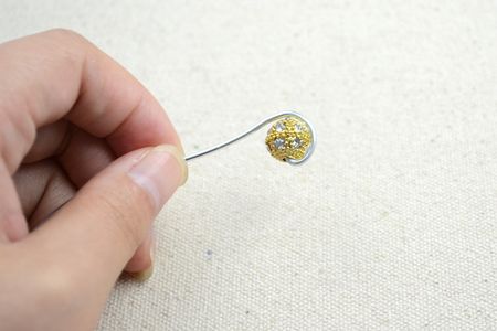 Hold Your Wire and Slide One Rhinestone Bead on the End