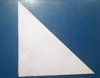 Fold It Diagonally, So That It Looks Like Triangle. And, Then Unfold It.