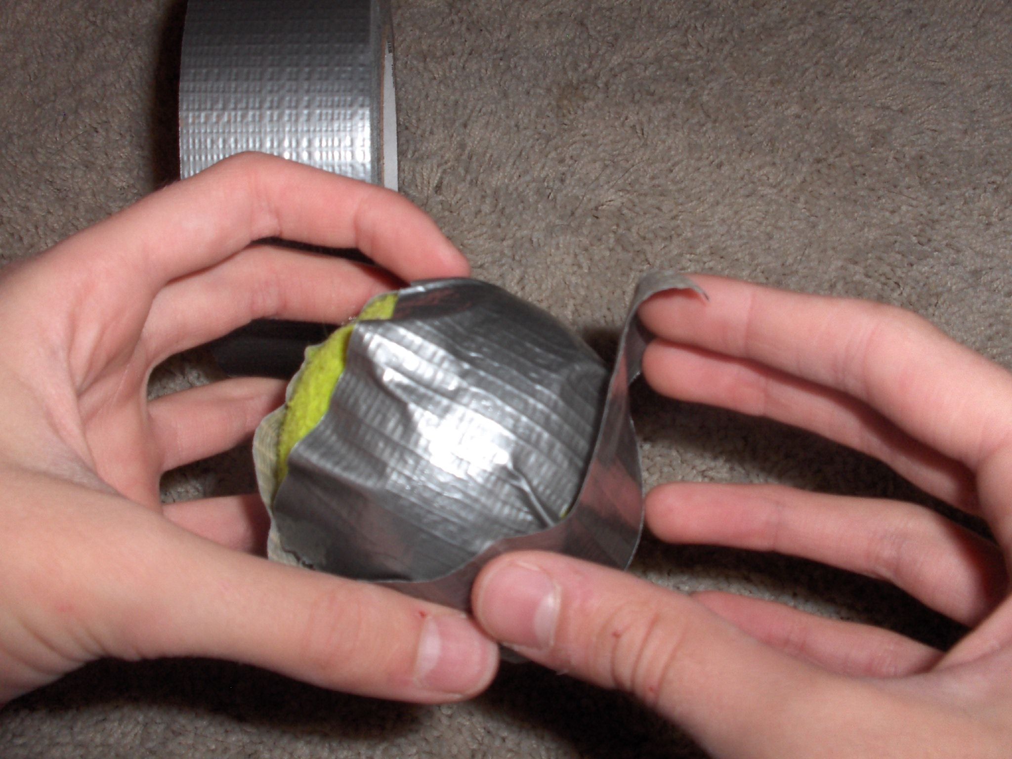 How to Make a Heavy Duct Tape Tennis Ball (Pitcher's Ball) 5 Steps