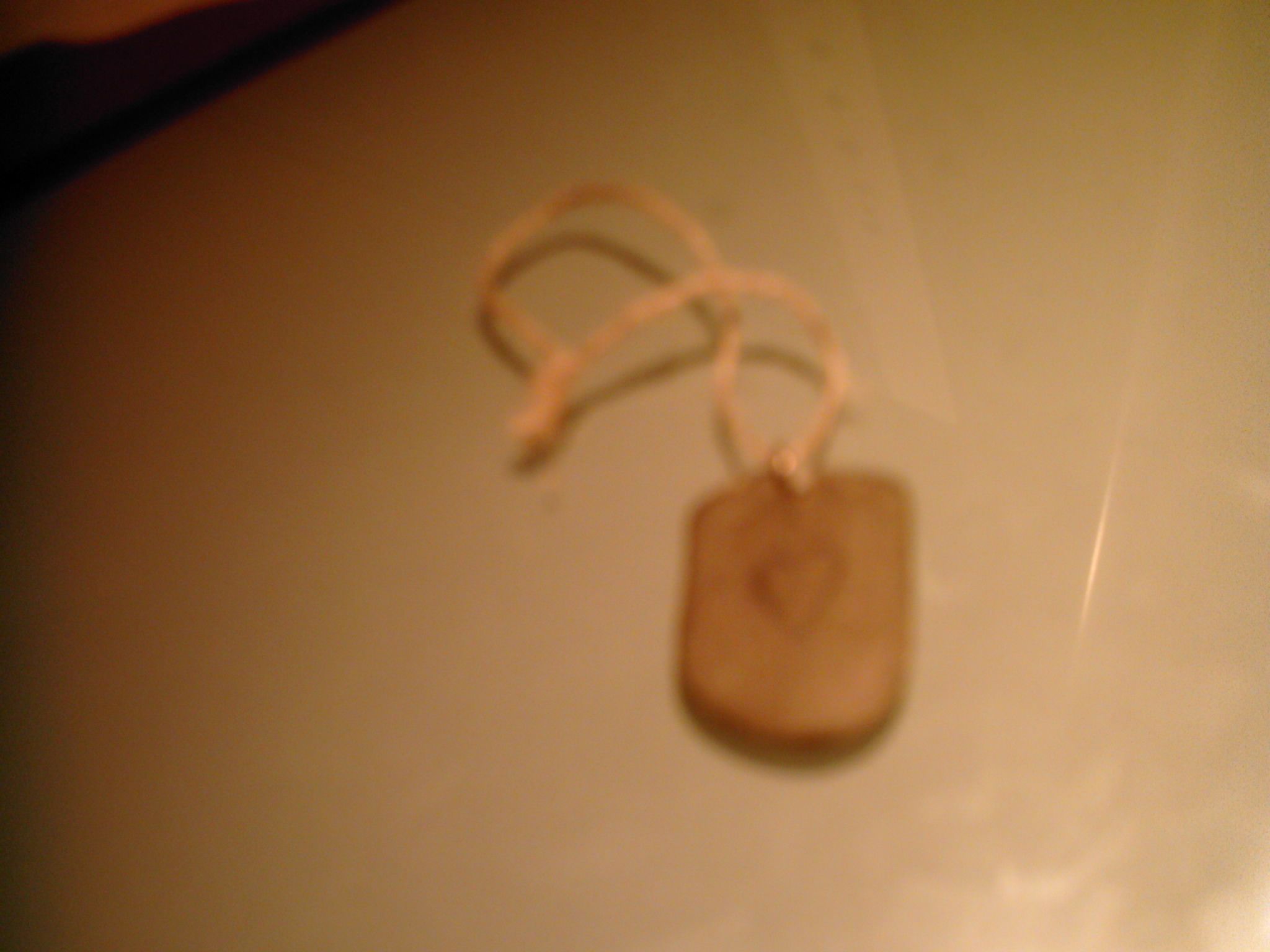 engraved stone pendant