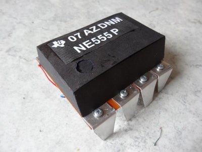 The Famous NE555 Timer-IC, Original and a Bit Larger