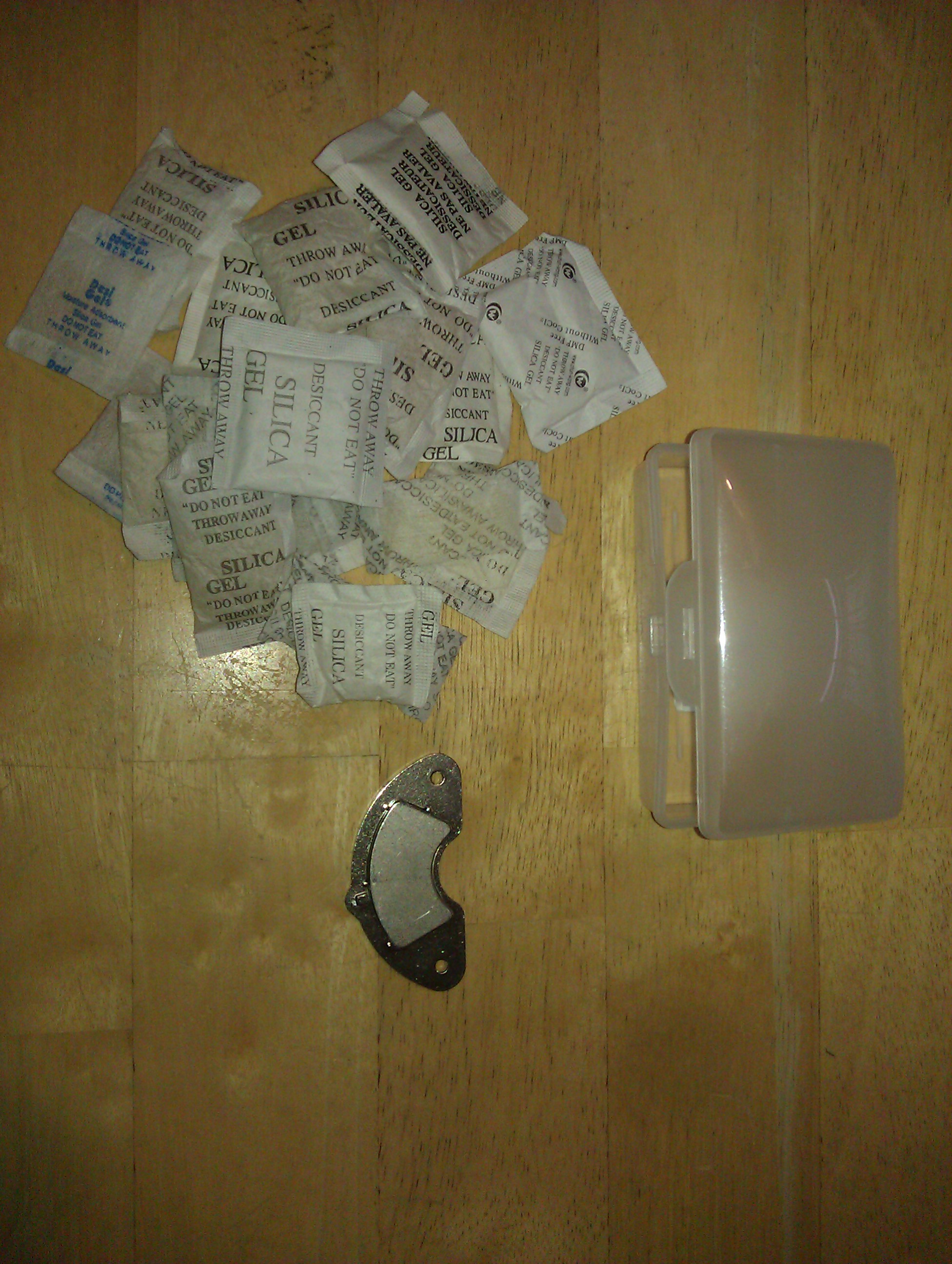 Inexpensive desiccant container for gun cabinet