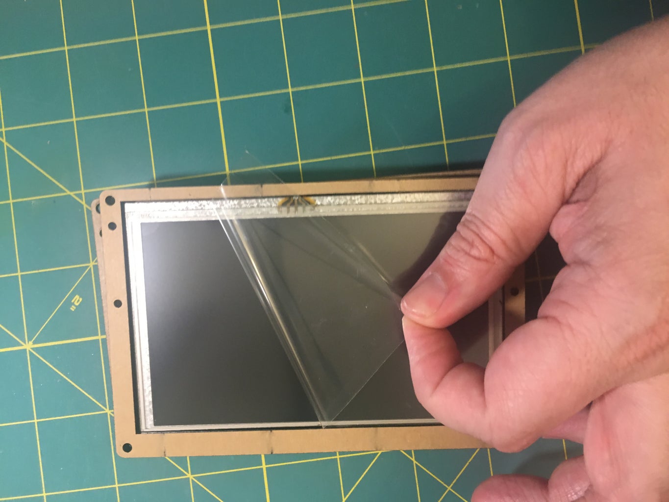 Remove the Film and Mount the Display