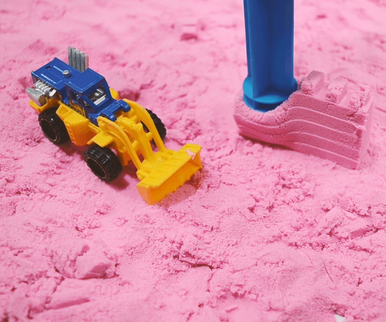 Playing on the Pink Beach Kinetic Sand With Truck