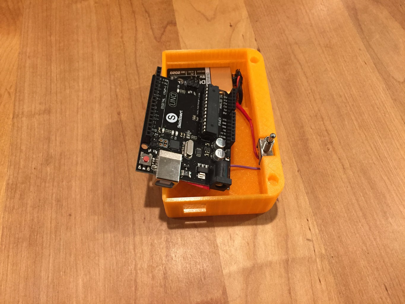 Insert the Arduino and Battery Into the Case